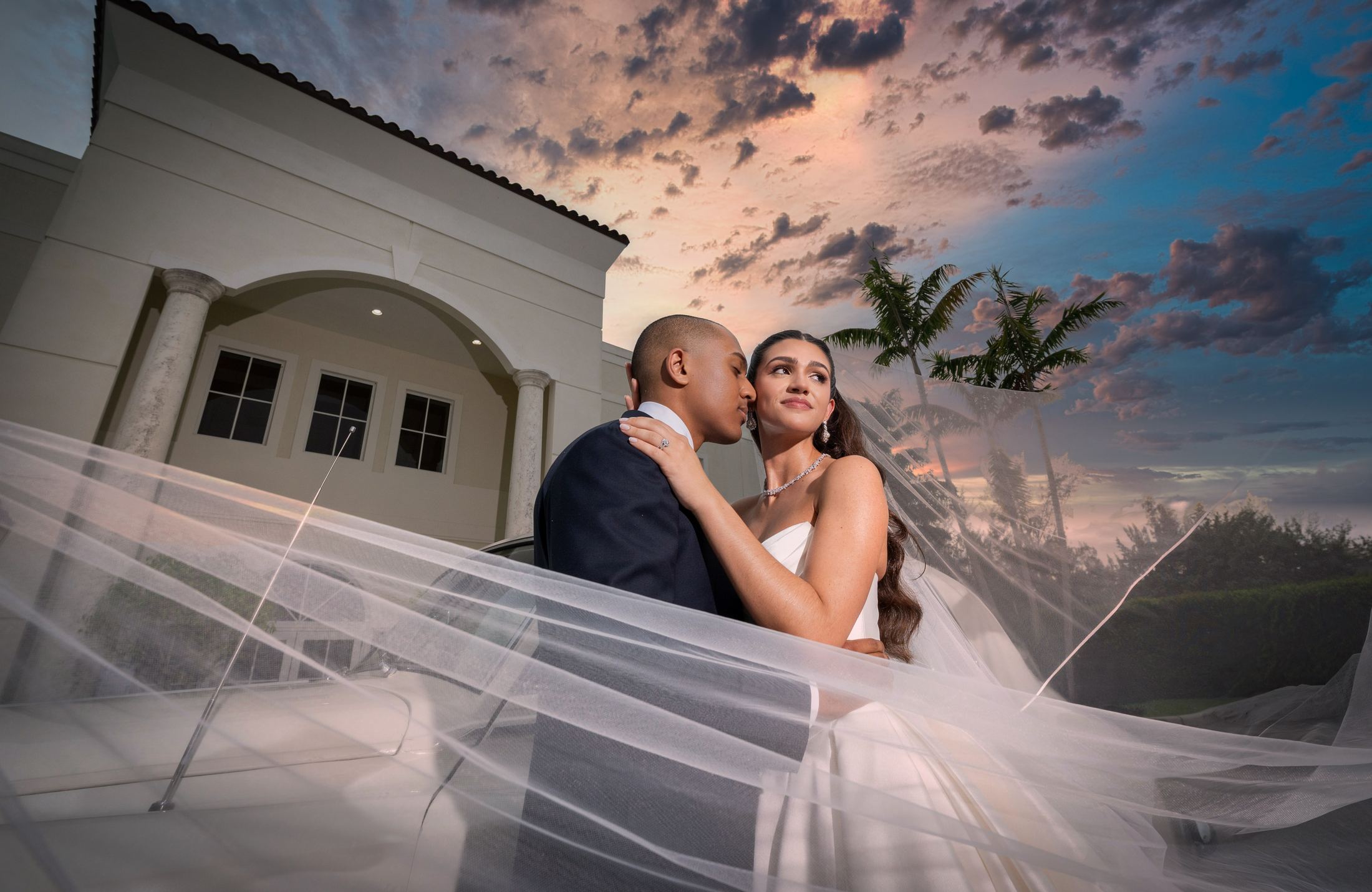 Bride and groom on Miami beach at sunset